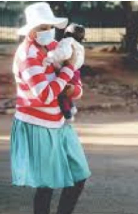 Mai TT holding another prisoner's baby